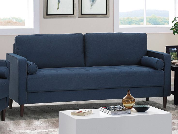 Living rooms with navy blue sofas