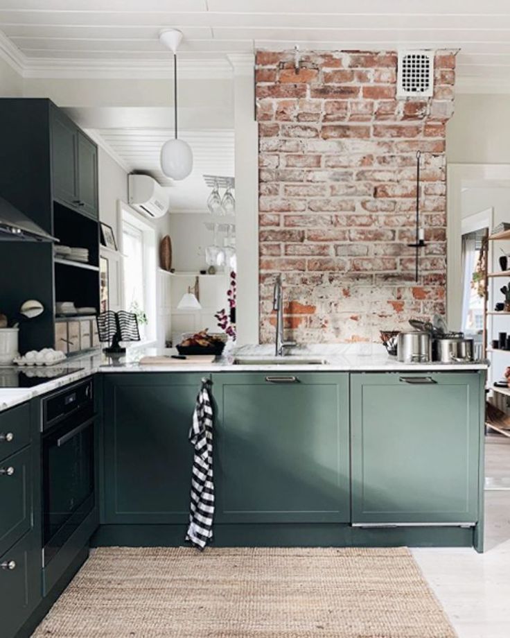 White kitchen with green walls