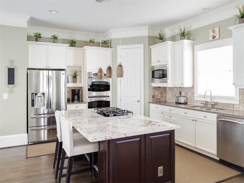 Decorating above kitchen cabinets with high ceilings