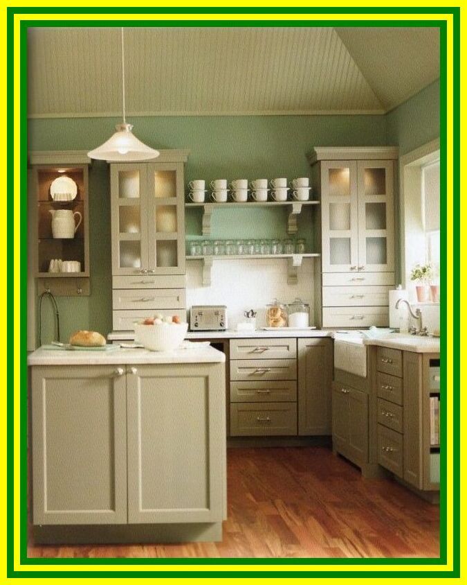 White kitchen with green walls