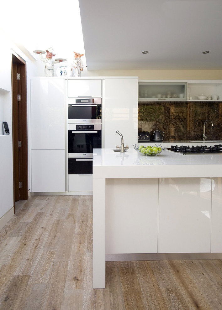 White kitchen with wooden floor